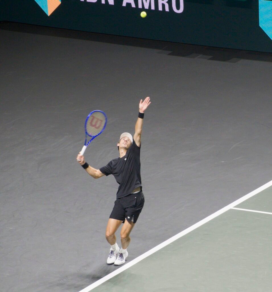 Alex de Minaur serves during his second-round match against Stan Wawrinka at the ABN AMRO Open in Rotterdam 2026.