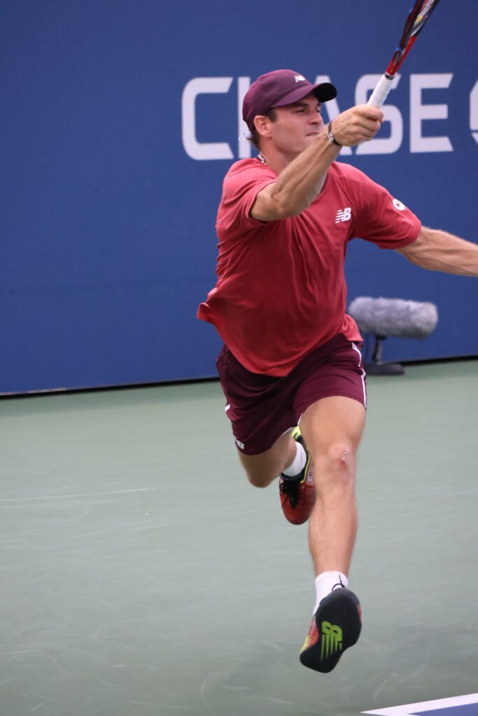 Tommy Paul hits a forehand during an ATP Tour match
