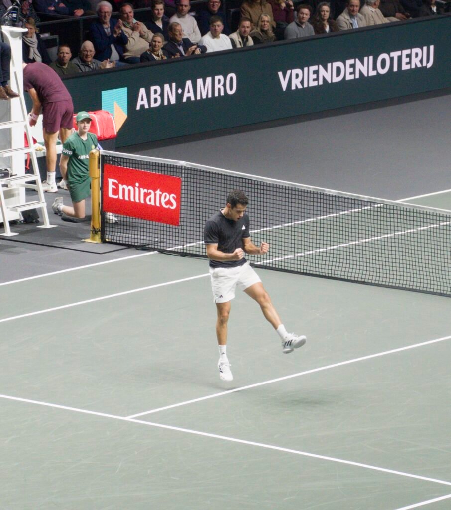 Jaume Munar celebrates after beating Karen Khachanov at Rotterdam 2026.