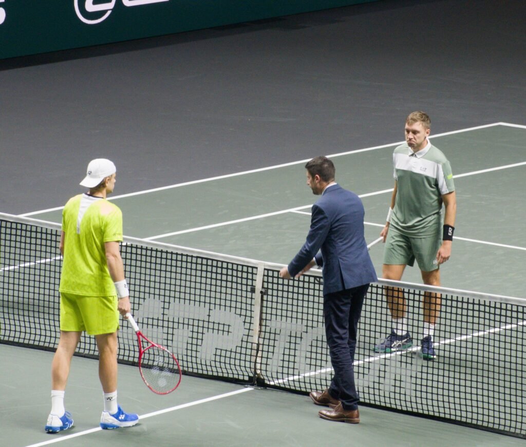 Hamad Medjedovic and Zizou Bergs with the chair umpire before their first-round match at the Rotterdam ATP 500 2026