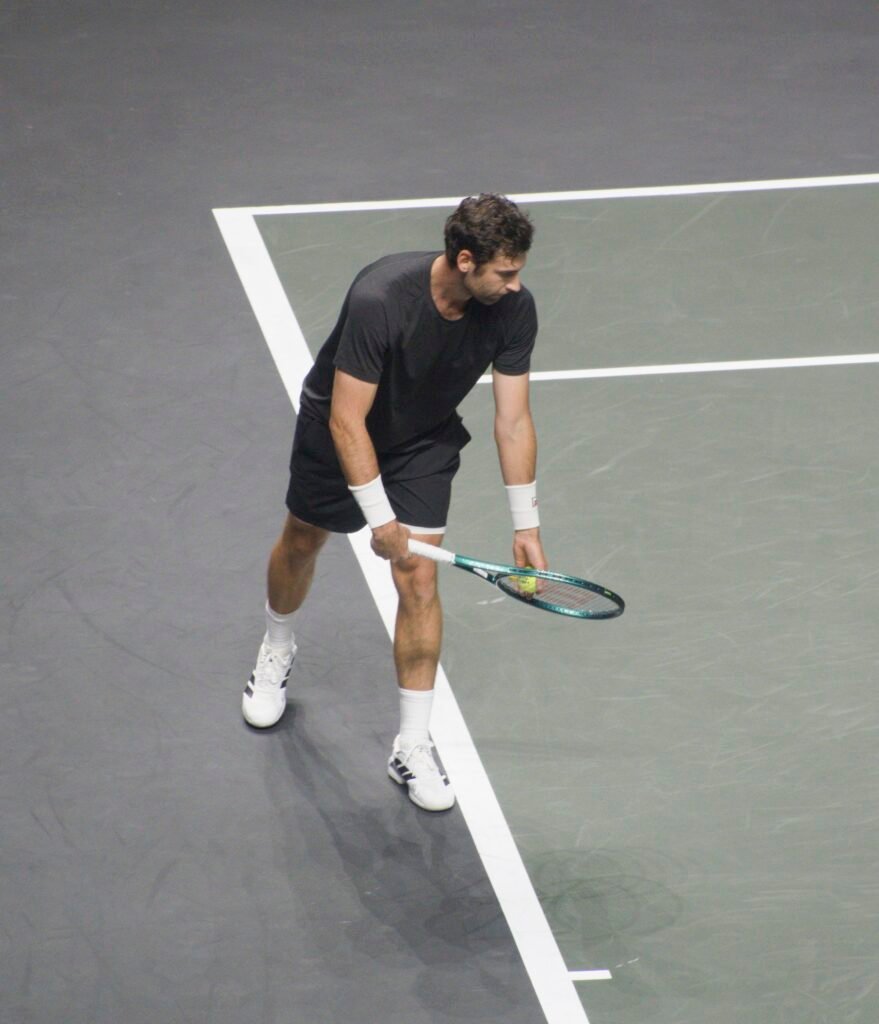 Quentin Halys prepares to serve during his match against Tallon Griekspoor at Rotterdam 2026.