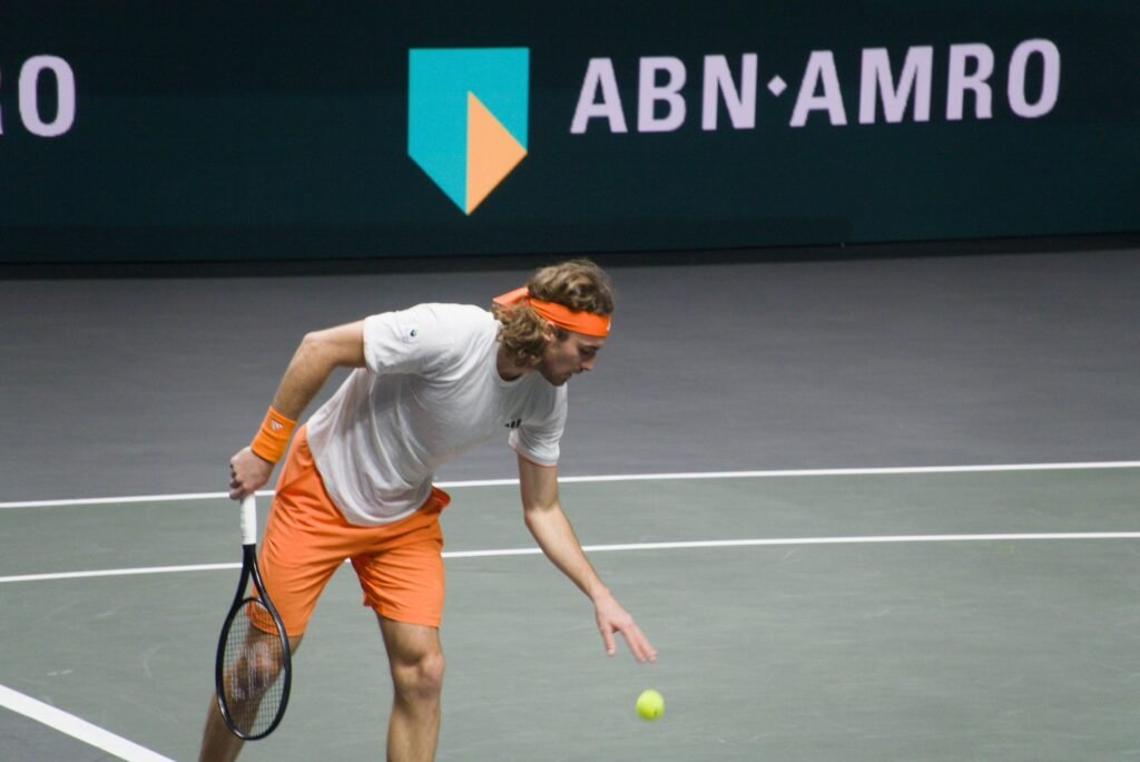 Stefanos Tsitsipas bounces the ball before serving during his first-round match against Arthur Rinderknech at the Rotterdam ATP 500 2026