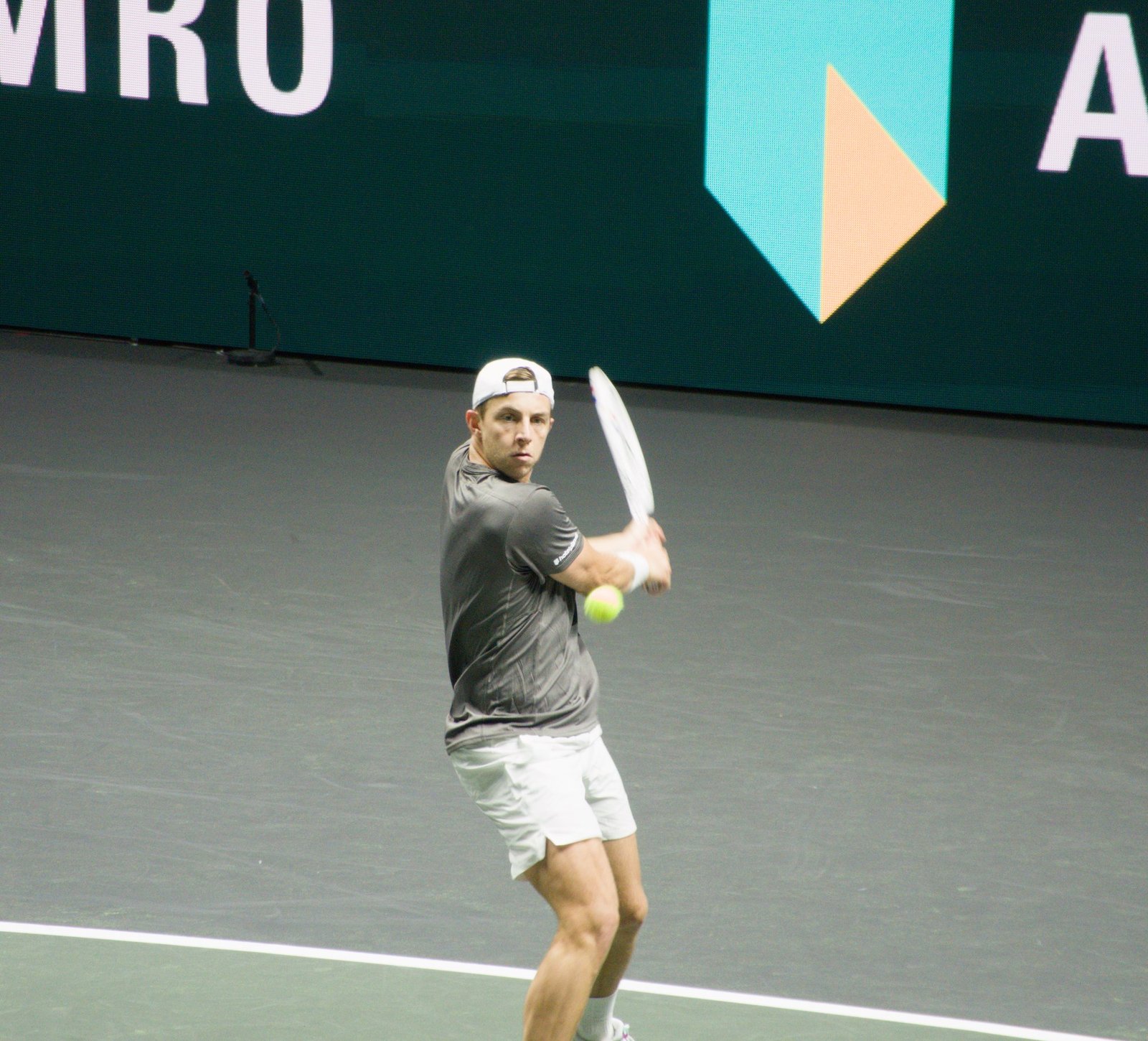 Tallon Griekspoor hits a backhand during his first-round match against Giovanni Mpetshi Perricard at the Rotterdam ATP 500 2026