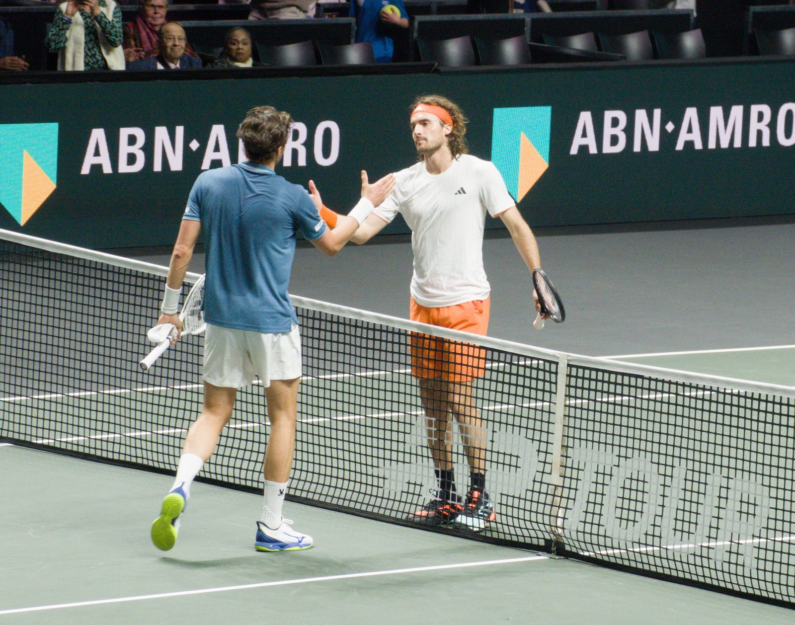 Stefanos Tsitsipas and Arthur Rinderknech shake hands after their first-round match at the Rotterdam ATP 500 2026