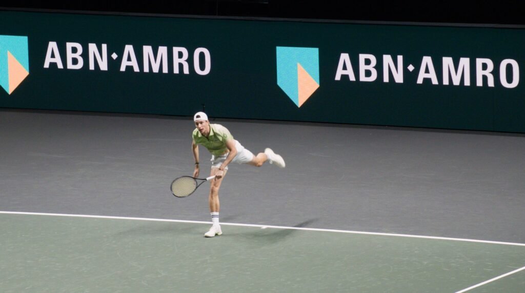 Ugo Humbert serves during his match against Daniil Medvedev at the Rotterdam ATP 500 2026 at Rotterdam Ahoy Arena