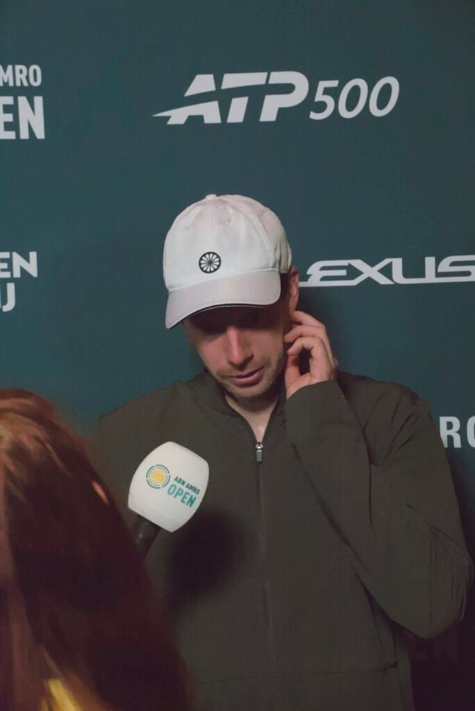 Botic van de Zandschulp speaks on court after his three-set quarter-final loss to Alex de Minaur at the ABN AMRO Open Rotterdam 2026.