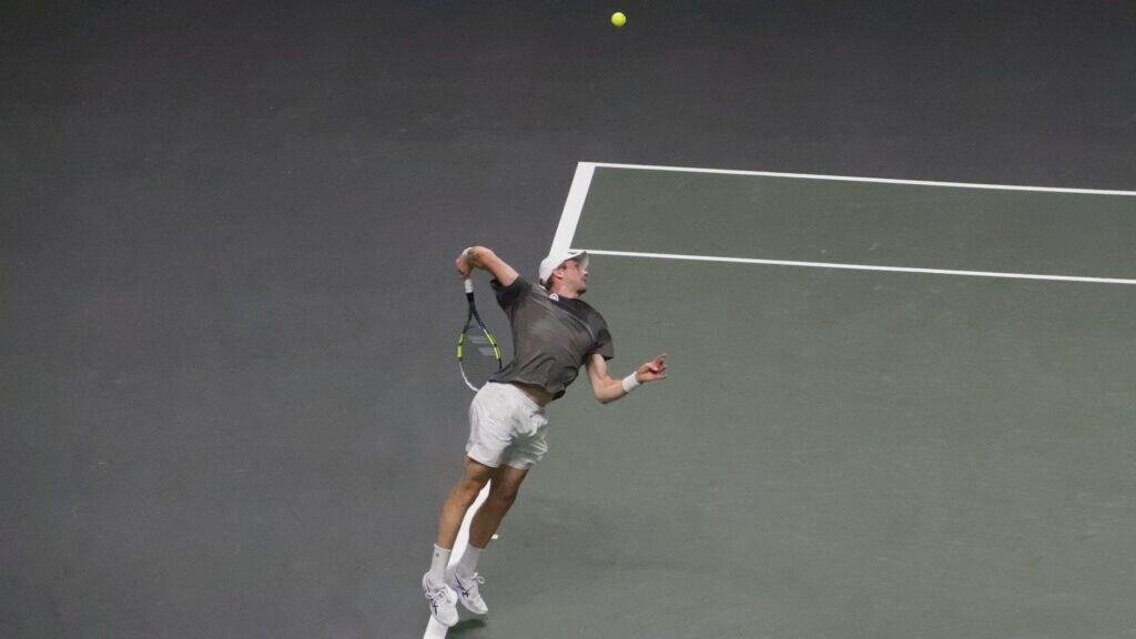 Botic van de Zandschulp hits a powerful smash from the baseline during his quarter-final against Alex de Minaur at the ABN AMRO Open Rotterdam 2026.