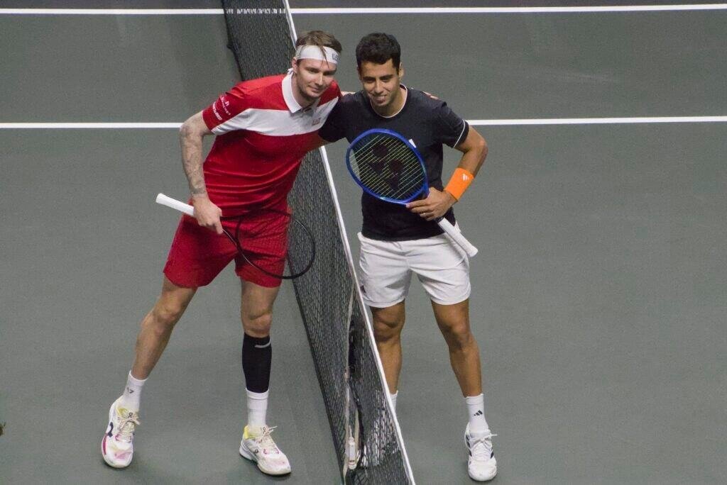 Alexander Bublik and Jaume Munar pose at the net during their quarter-final match at the ABN AMRO Open Rotterdam 2026.