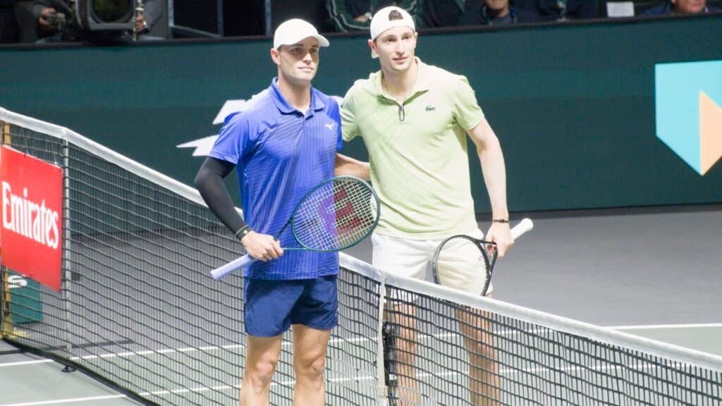 Ugo Humbert and Christopher O'Connell pose at the net before their quarter-final at the ABN AMRO Open Rotterdam 2026.