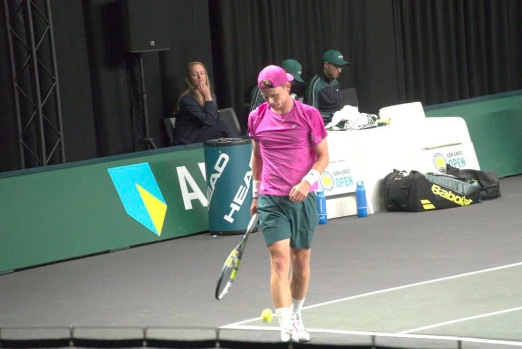 Jesper de Jong in pink Head kit on court during 1/16 final match vs Karen Khachanov at ABN AMRO Open Rotterdam ATP 500 2026. ​ ​