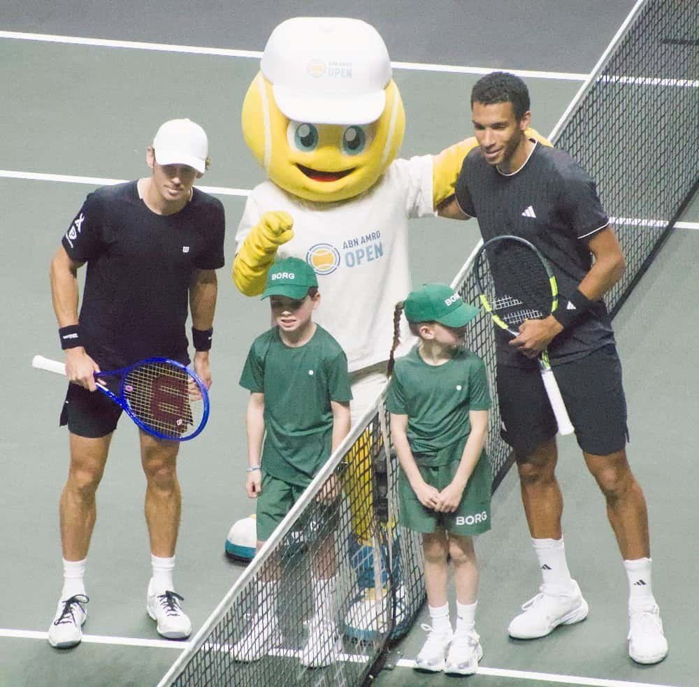 Champion Alex de Minaur with the tournament mascot and kids at the net after the ABN AMRO Open Rotterdam 2026 final.