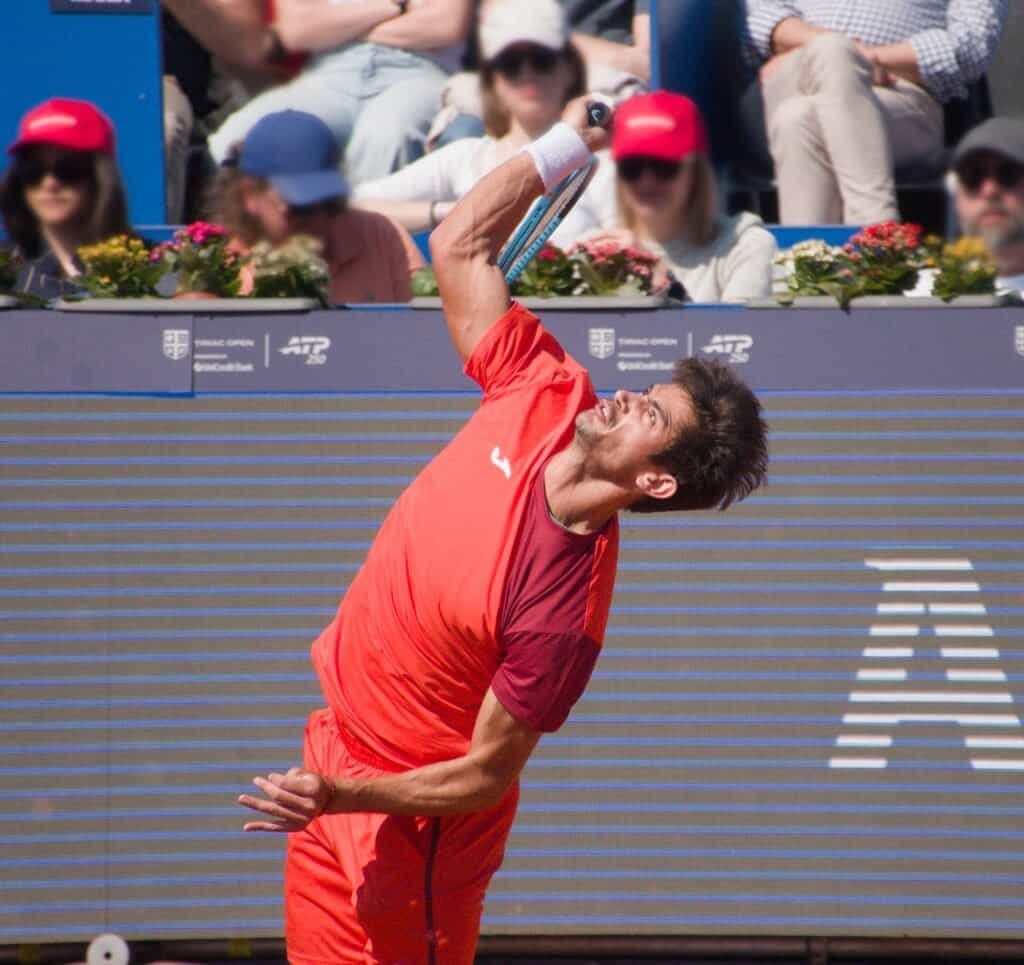 Mariano Navone in full stretch during a powerful serve at the Tiriac Open 2026 in Bucharest