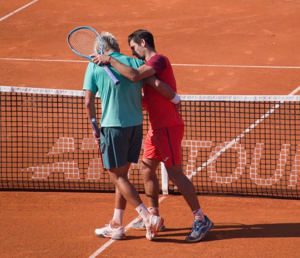 Mariano Navone and Daniel Merida embracing at the net after the Tiriac Open 2026 final in Bucharest