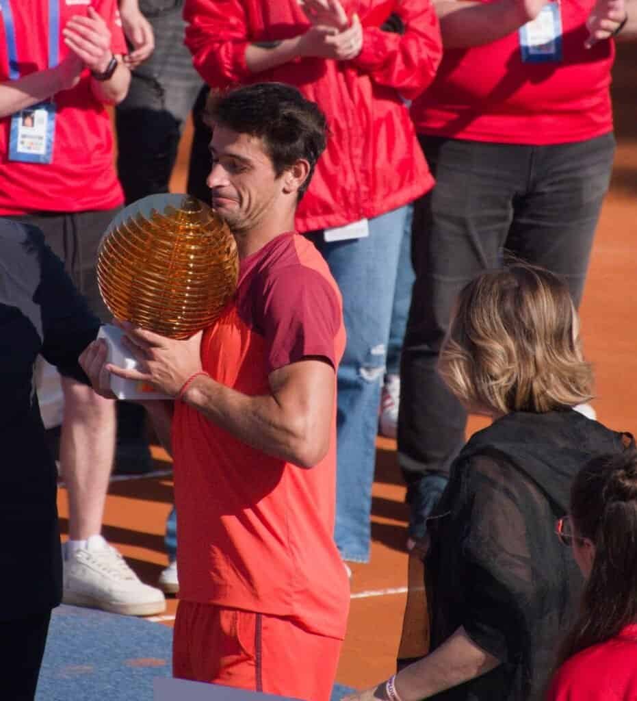 Mariano Navone holding the winner's trophy at the Tiriac Open 2026 prize ceremony in Bucharest