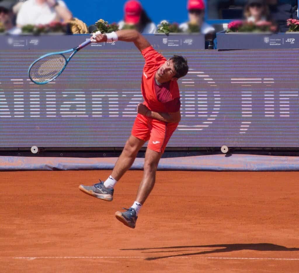 Mariano Navone jumping for a powerful overhead smash during the Tiriac Open 2026 final in Bucharest