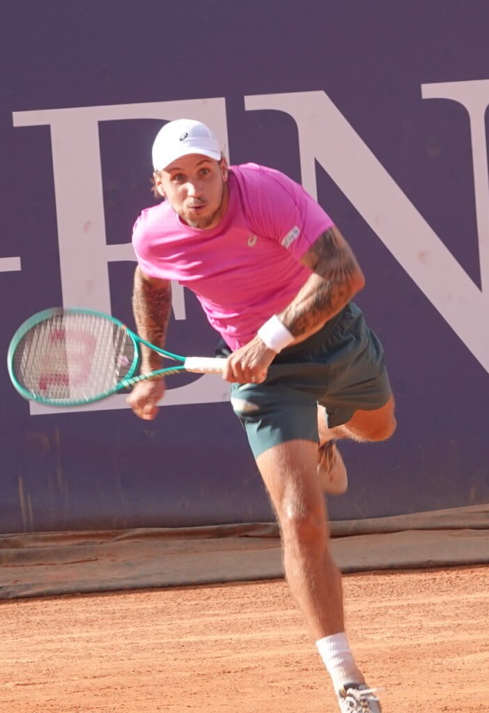 Slovak tennis player Alex Molcan hitting a forehand during his quarterfinal match in Kitzbuhel on clay