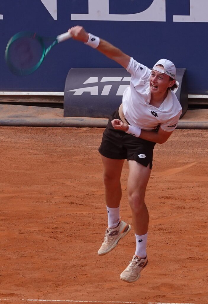 Player Alexander Buse hitting a forehand during his match in Kitzbuhel on clay