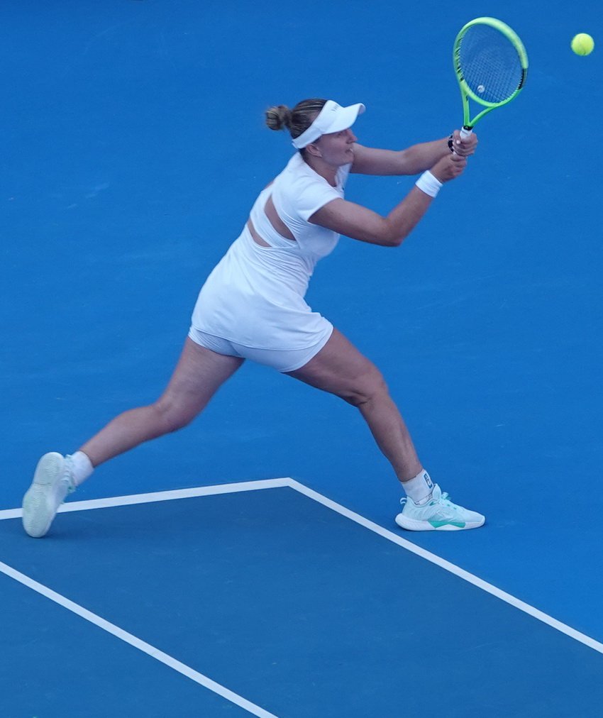 Czech tennis player Barbora Krejcikova stretching on the run to hit a forehand shot during the Athens Open 26 tournament