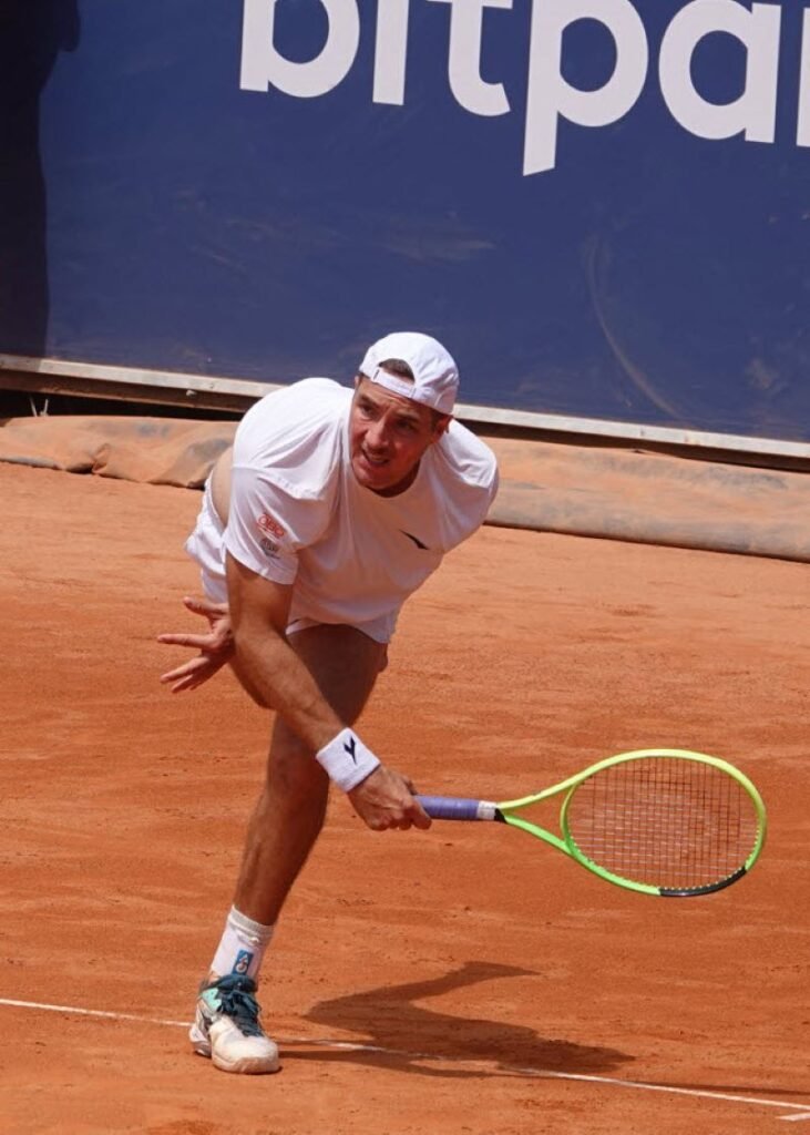 German tennis player Jan-Lennard Struff preparing to hit a forehand during his first-round match in Kitzbuhel on clay