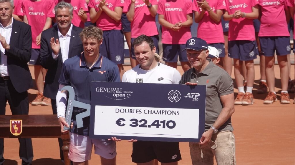 Lucas Miedler and Marc Polmans holding the prize money cheque after winning the doubles final at the 2026 Generali Open Kitzbuhel