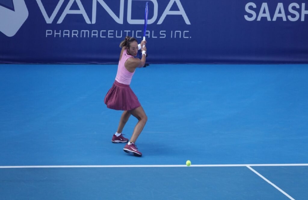 Chinese tennis player Qinwen Zheng hitting a backhand at the WTA Athens Open 2026.