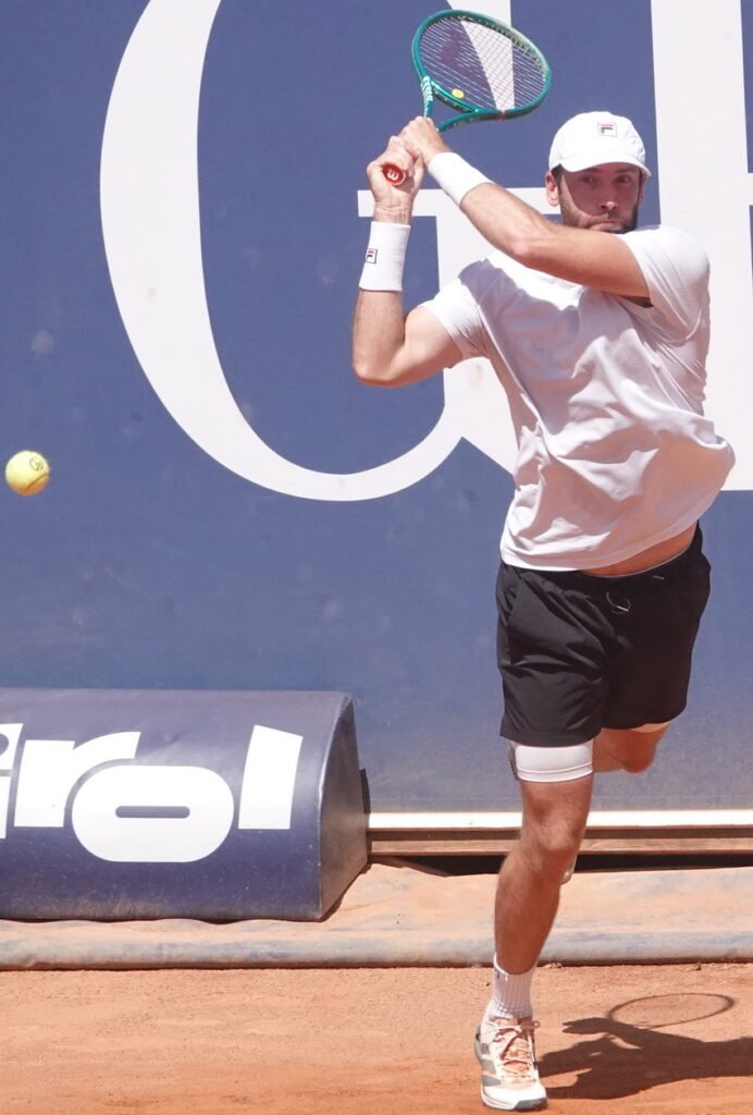 French tennis player Quentin Halys hitting a forehand during his semifinal match in Kitzbuhel on clay