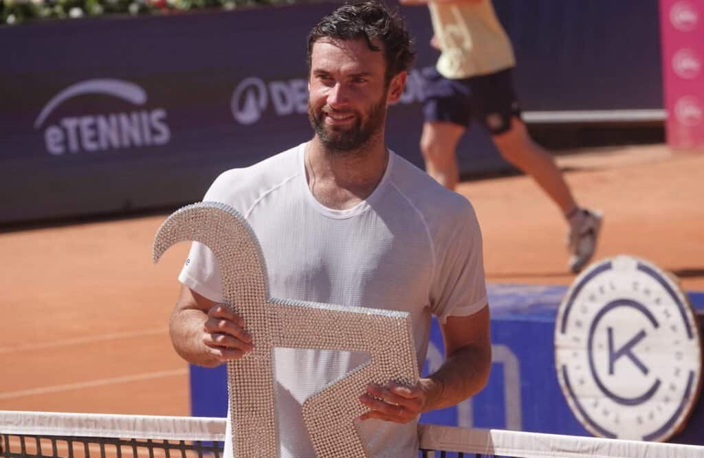 French tennis player Quentin Halys holding the trophy after his final win in Kitzbuhel Caption: Quentin Halys celebrates after winning the final in Kitzbuhel. Photo: Jovica Rutešić