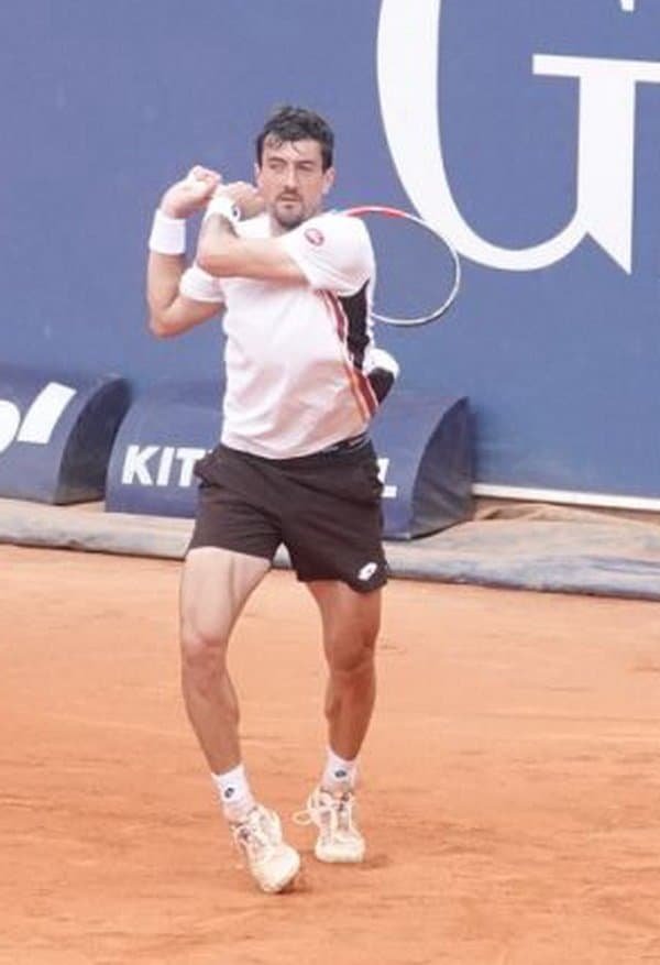 Austrian tennis player Sebastian Ofner hitting a forehand during his first-round match in Kitzbuhel on clay