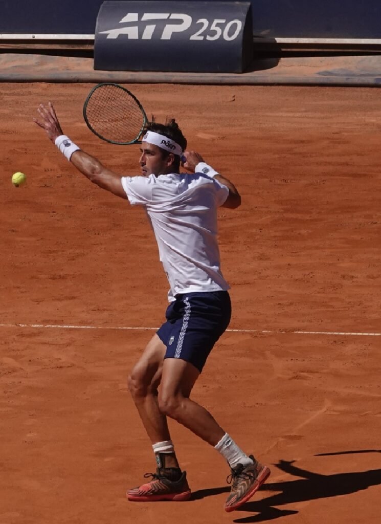 Argentine tennis player Tomas Etcheverry hitting a backhand during his semifinal match in Kitzbuhel on clay