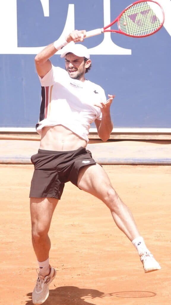 Monegasque tennis player Valentin Vacherot hitting an overhead shot during his match in Kitzbuhel on clay