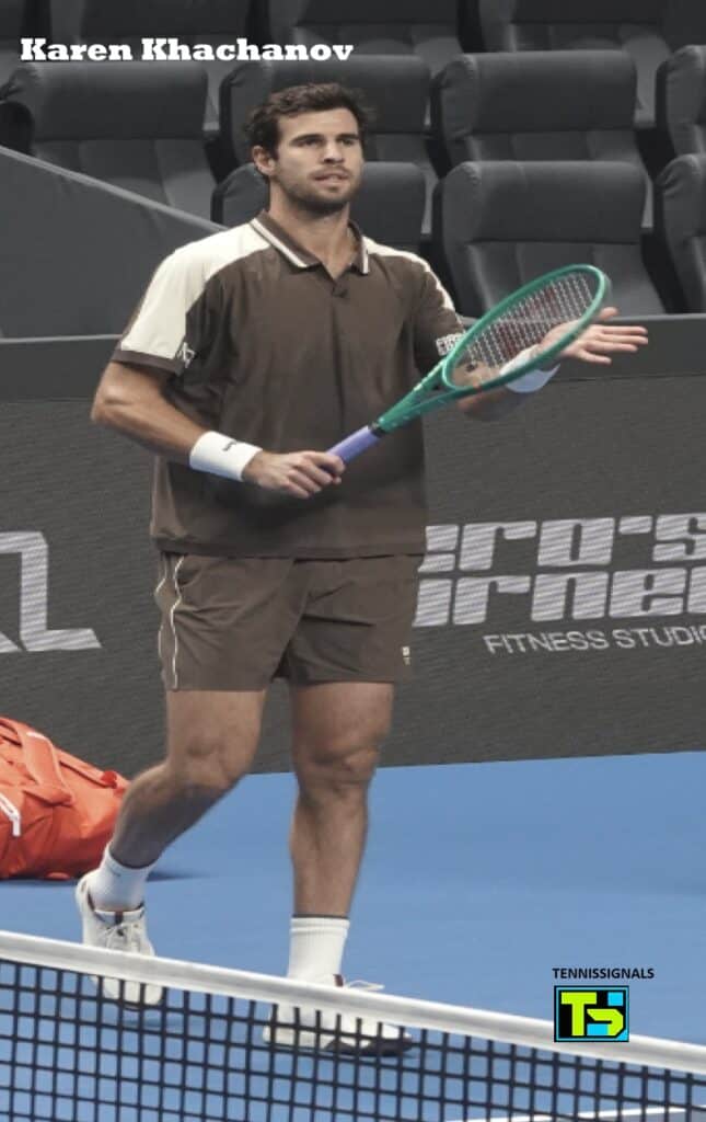 Karen Khachanov raising his hand to greet the crowd after his victory over Rei Sakamoto at the Almaty tournament.