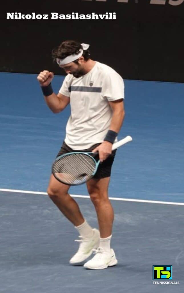 Nikoloz Basilashvili pumping his fist in celebration after winning his semifinal match at the ATP Almaty tournament.