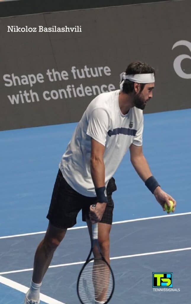 Nikoloz Basilashvili in action, hitting a shot during his first-round match against Marin Cilic at the Almaty tournament.