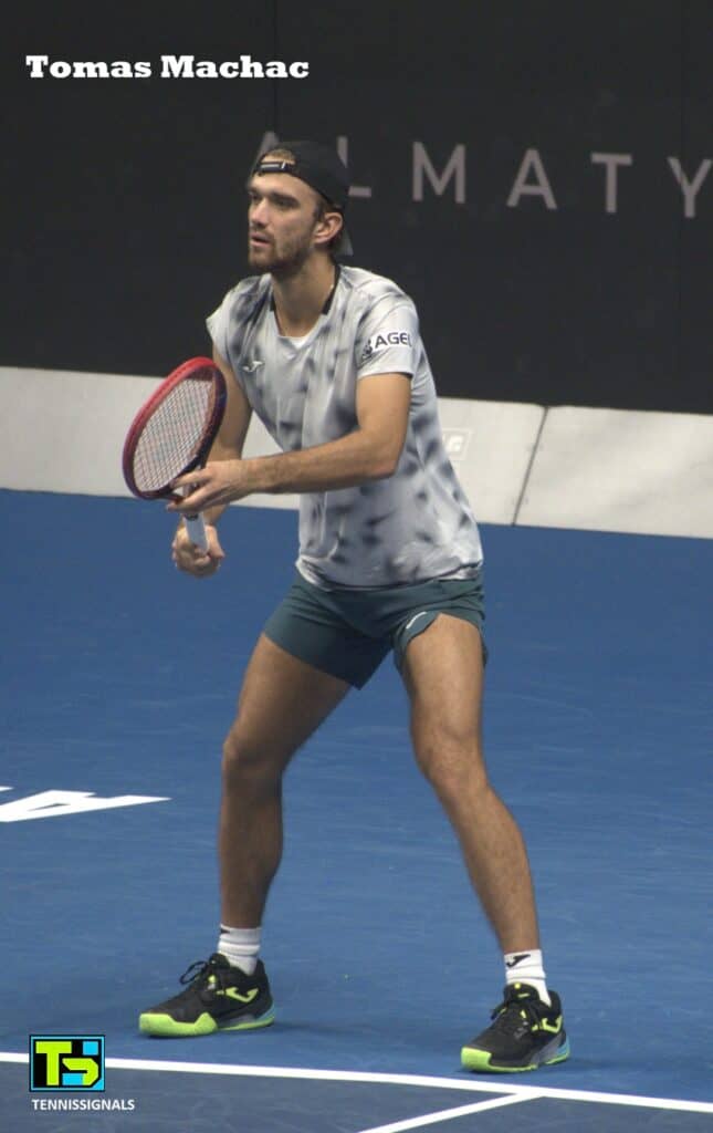 Tomas Machac on court preparing for a shot during his first-round match against Zangar Nurlanuly at the Almaty tournament.